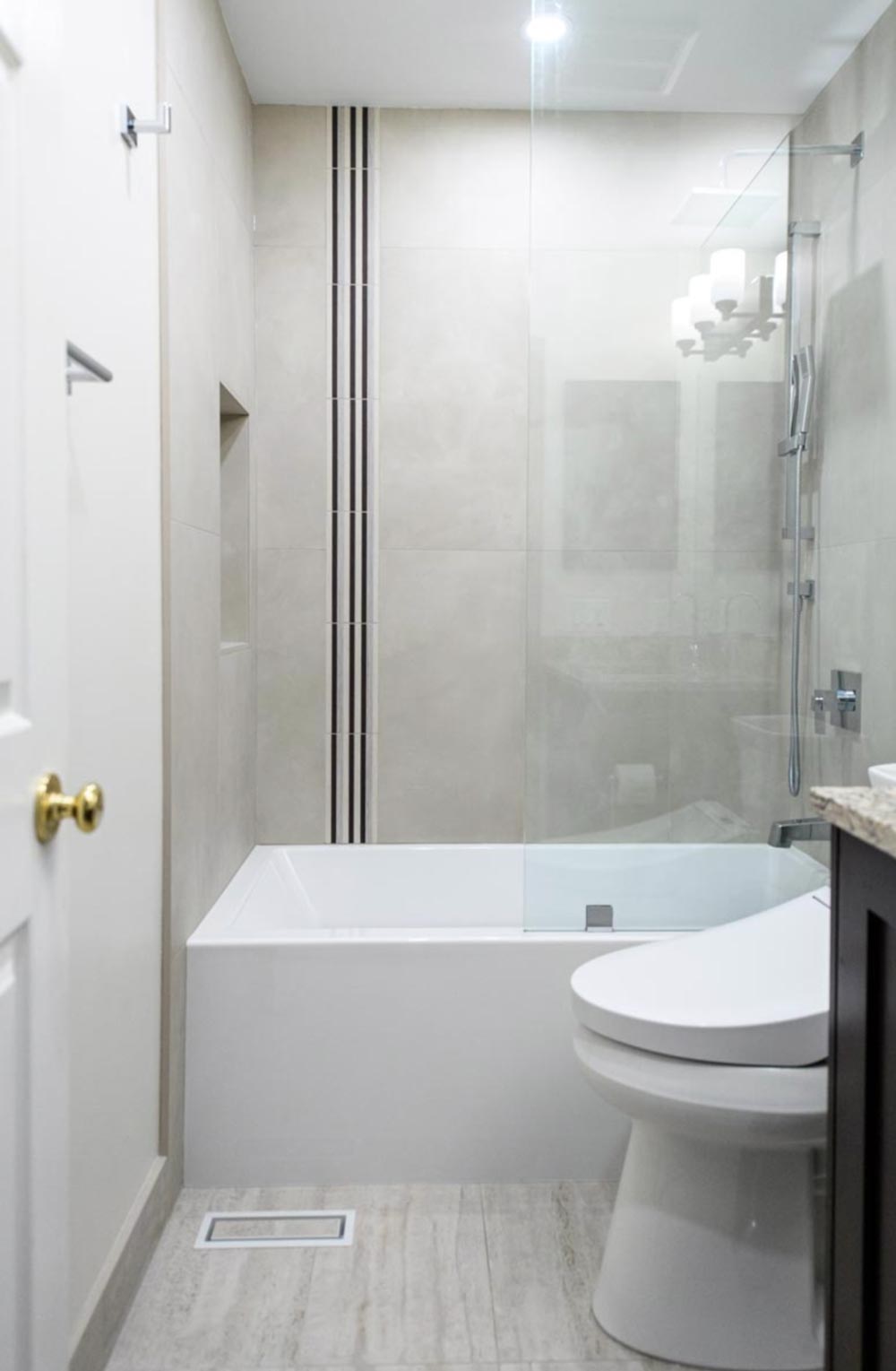 A shower-over-tub bathroom setup